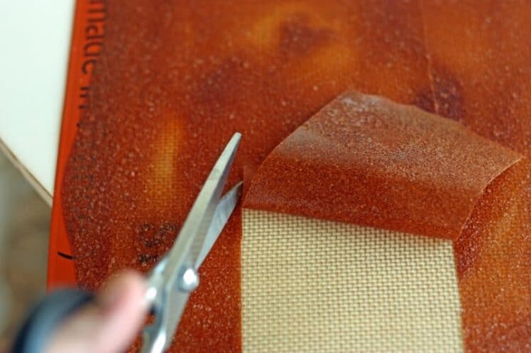 Homemade Fruit Roll-Ups (No Dehydrator Needed) 7 Cutting fruit leather.jpg